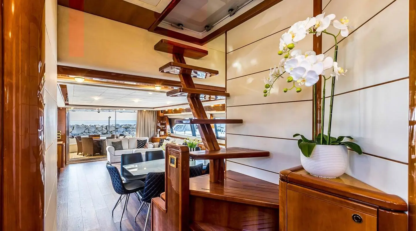 Miss Katariina yacht interior with wooden stairs and seating area