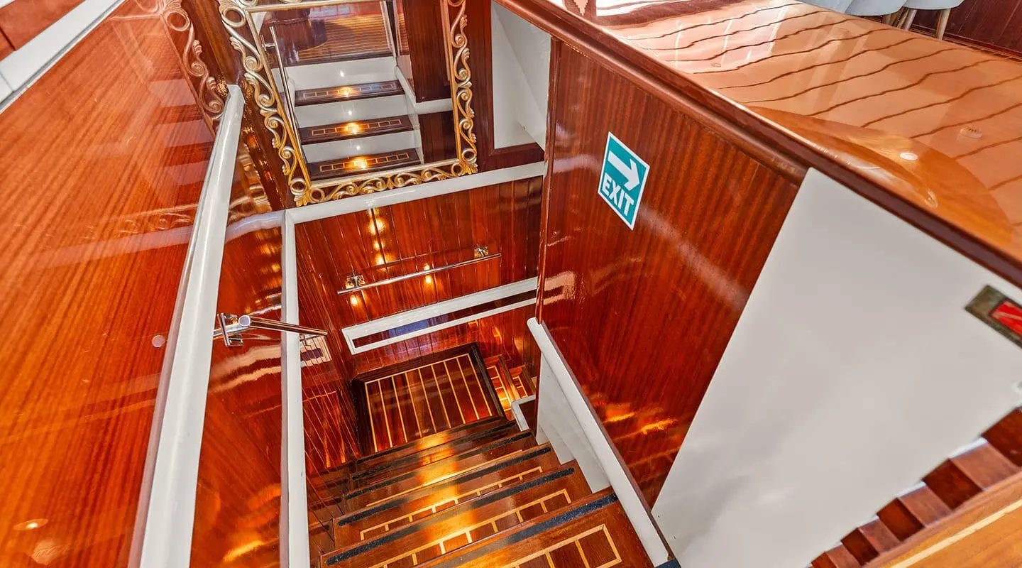 Esma Sultan yacht interiors with wooden stairs and cabin doors visible