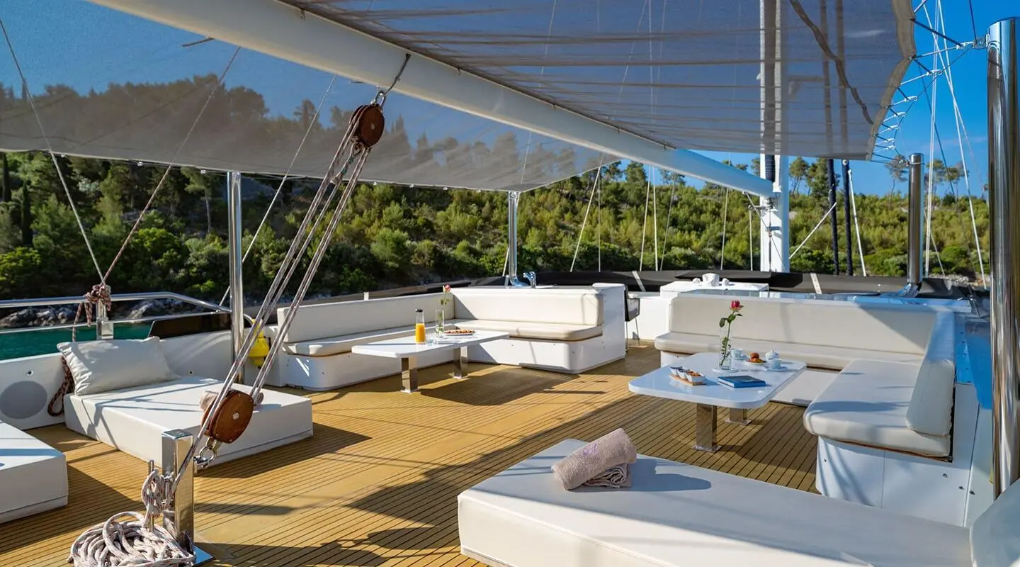 Navilux yacht deck area with sun loungers and seating under shade