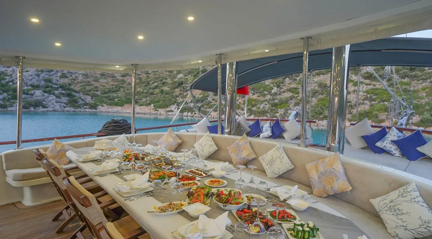 Prenses Esila yacht dining area with a long seafood spread and ocean view