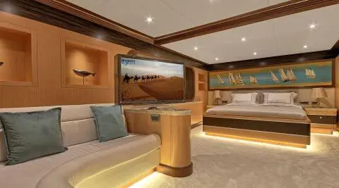 Meira yacht deck interior with seating, wooden accents, and large window view