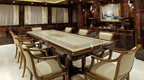 Ornate dining area aboard O'Rion yacht with marble table and elegant chairs