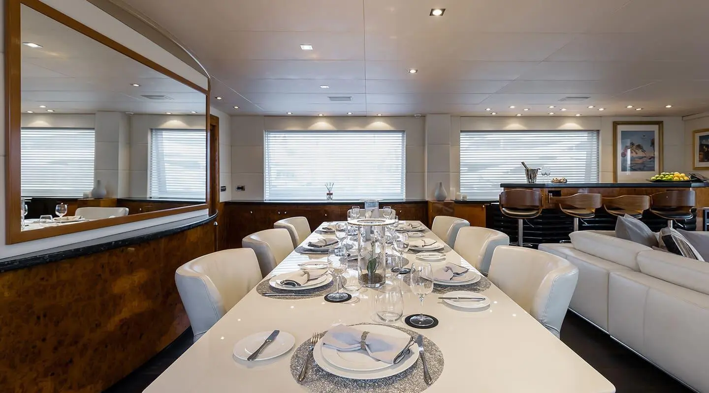 Yacht Brooklyn dining deck set for guests with white tableware