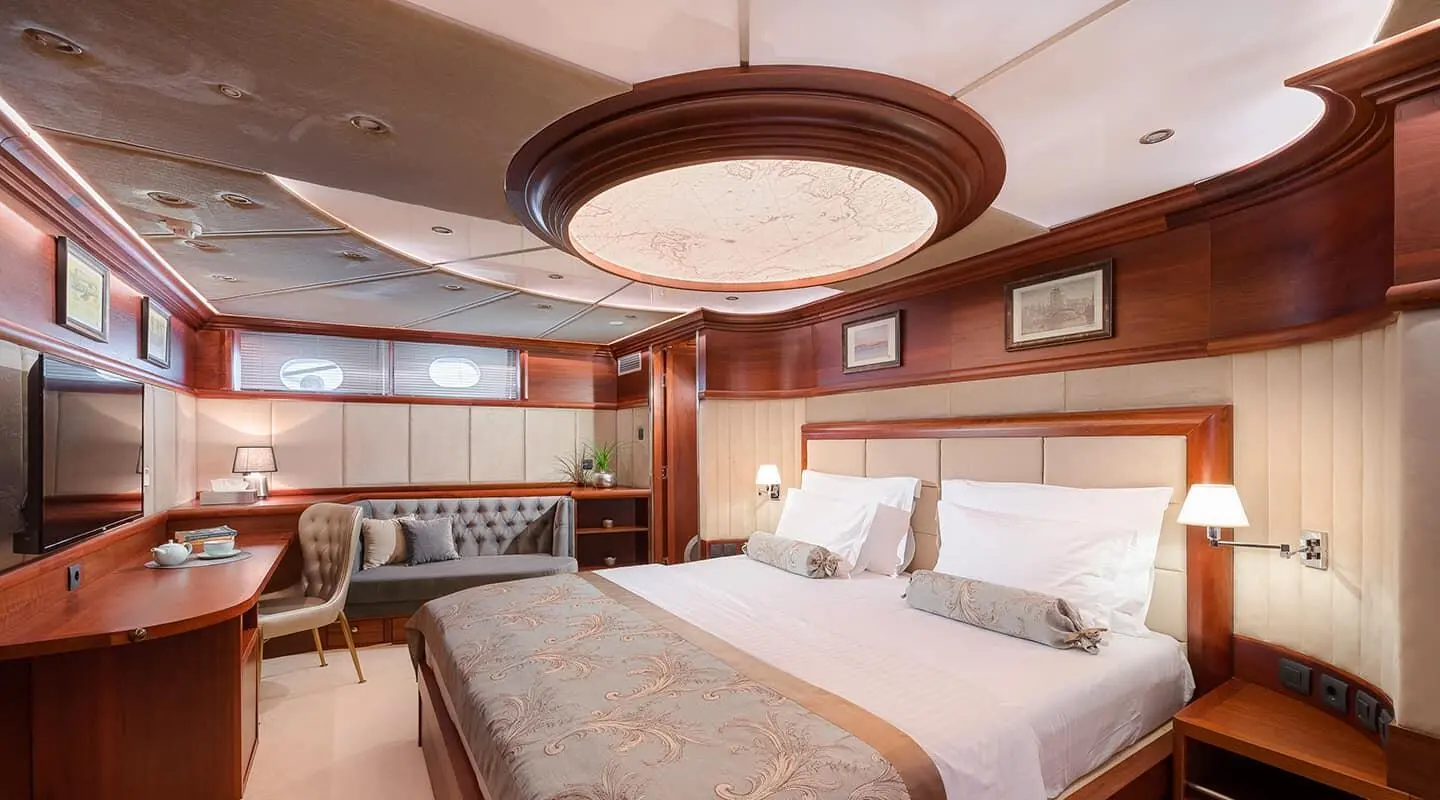 Lady Gita luxury yacht interior with two single beds, warm wood tones