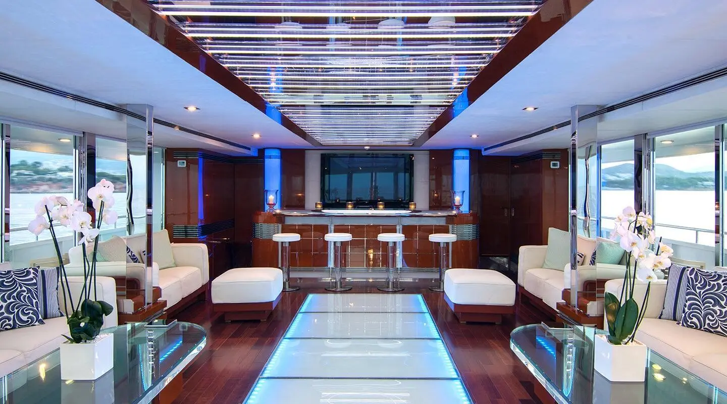 Luxurious yacht saloon on O'Natalina with polished wood panels and seating