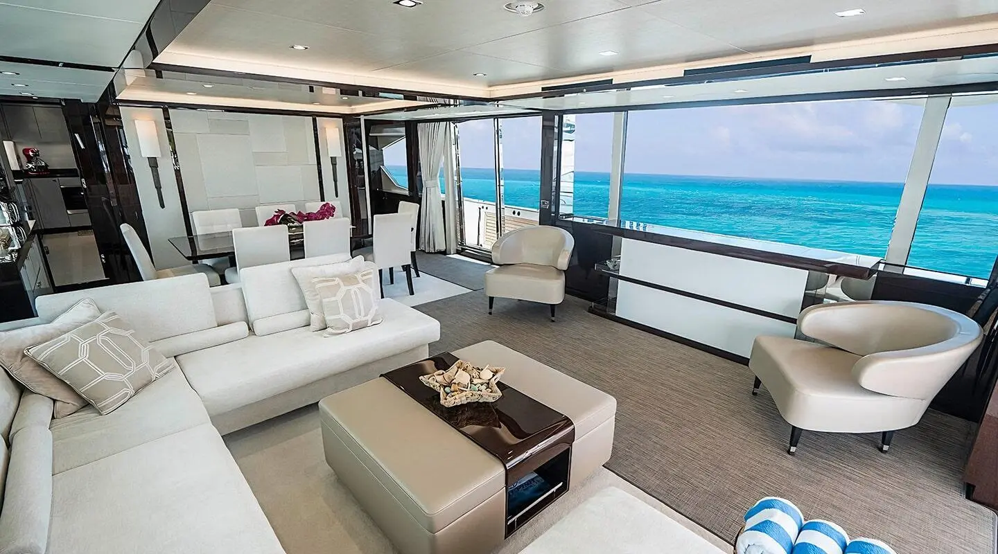 Quantum luxury yacht interior: bright salon with white furnishings and ocean view