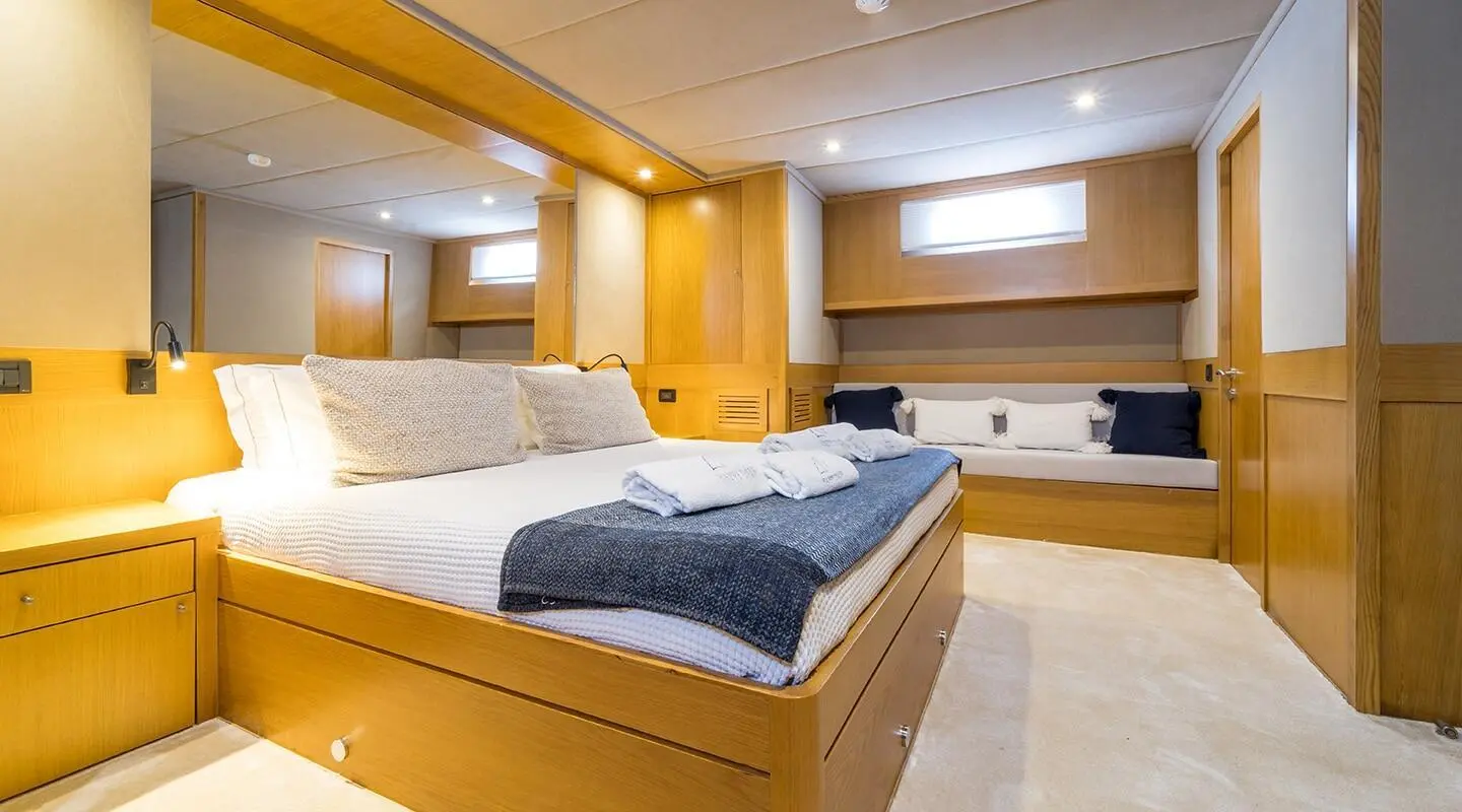 Luxury interior of the Happy Days yacht with wood finishes and seating area