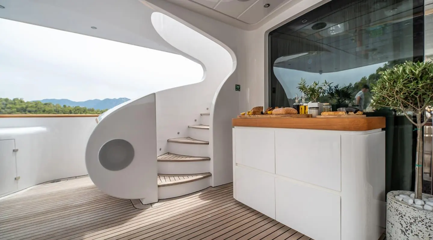 Pareaki II luxury yacht deck stairs and railing, white and light wood finish