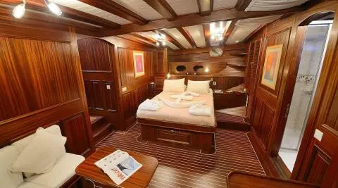 Zephyria II luxurious mahogany-clad cabin with king-size bed and polished wood interiors