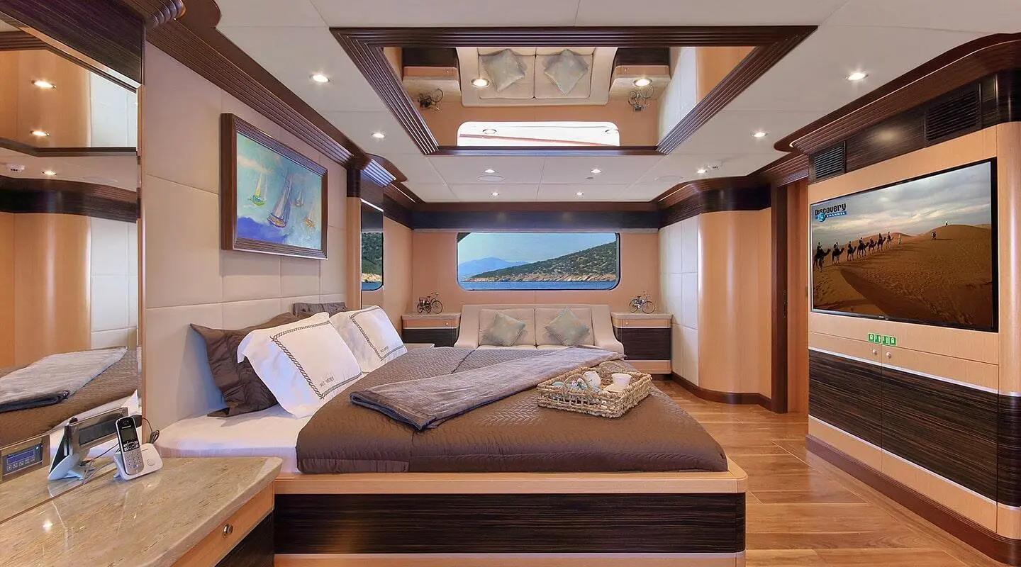 Meira yacht exterior interior viewed with a large bed and wood accents