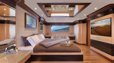 Meira yacht exterior interior viewed with a large bed and wood accents