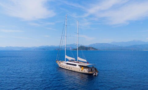 King Of The Sea yacht anchored in calm blue sea