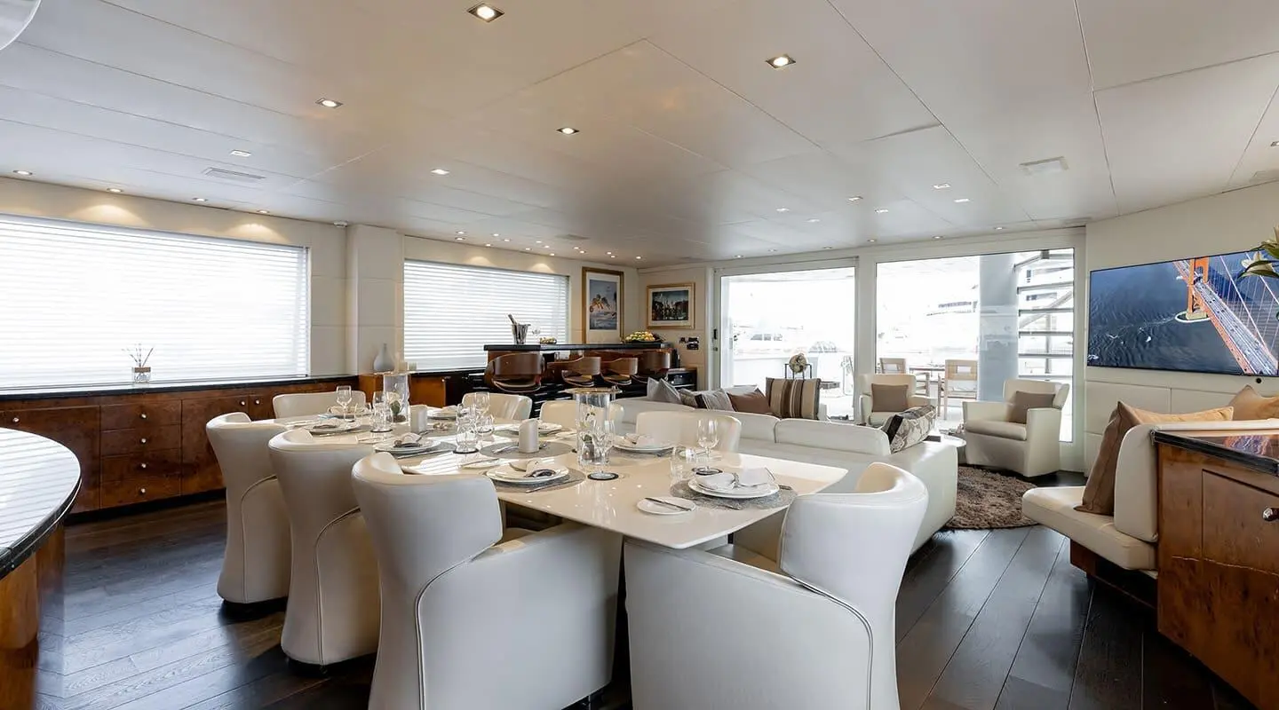 Elegant yacht Brooklyn dining lounge with round tables and white chairs