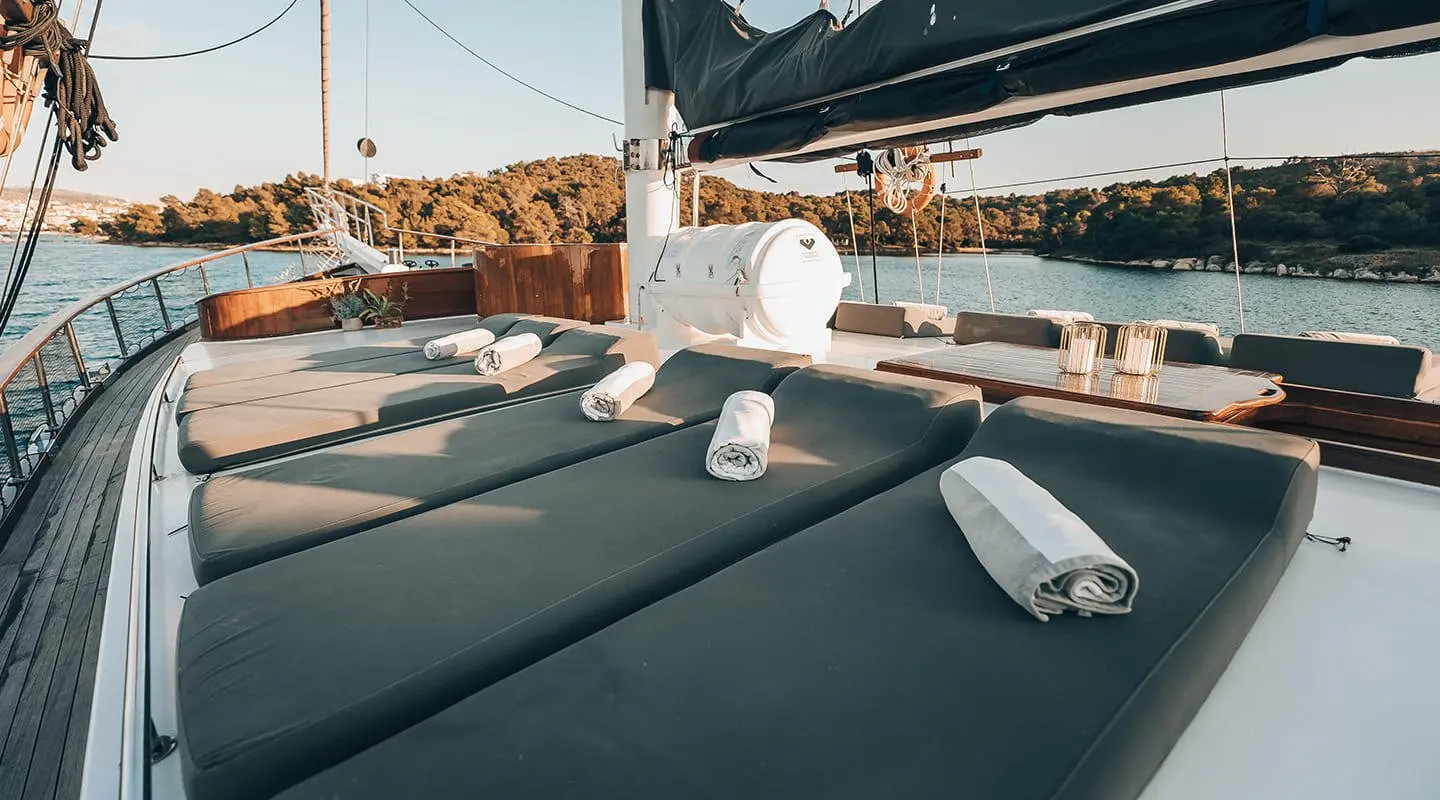 Gulet yacht with sun loungers and cushions on deck