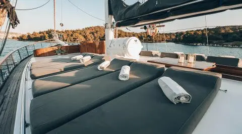 Gulet yacht with sun loungers and cushions on deck