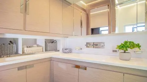 D2 motor yacht galley with countertop, cabinets and clean lighting