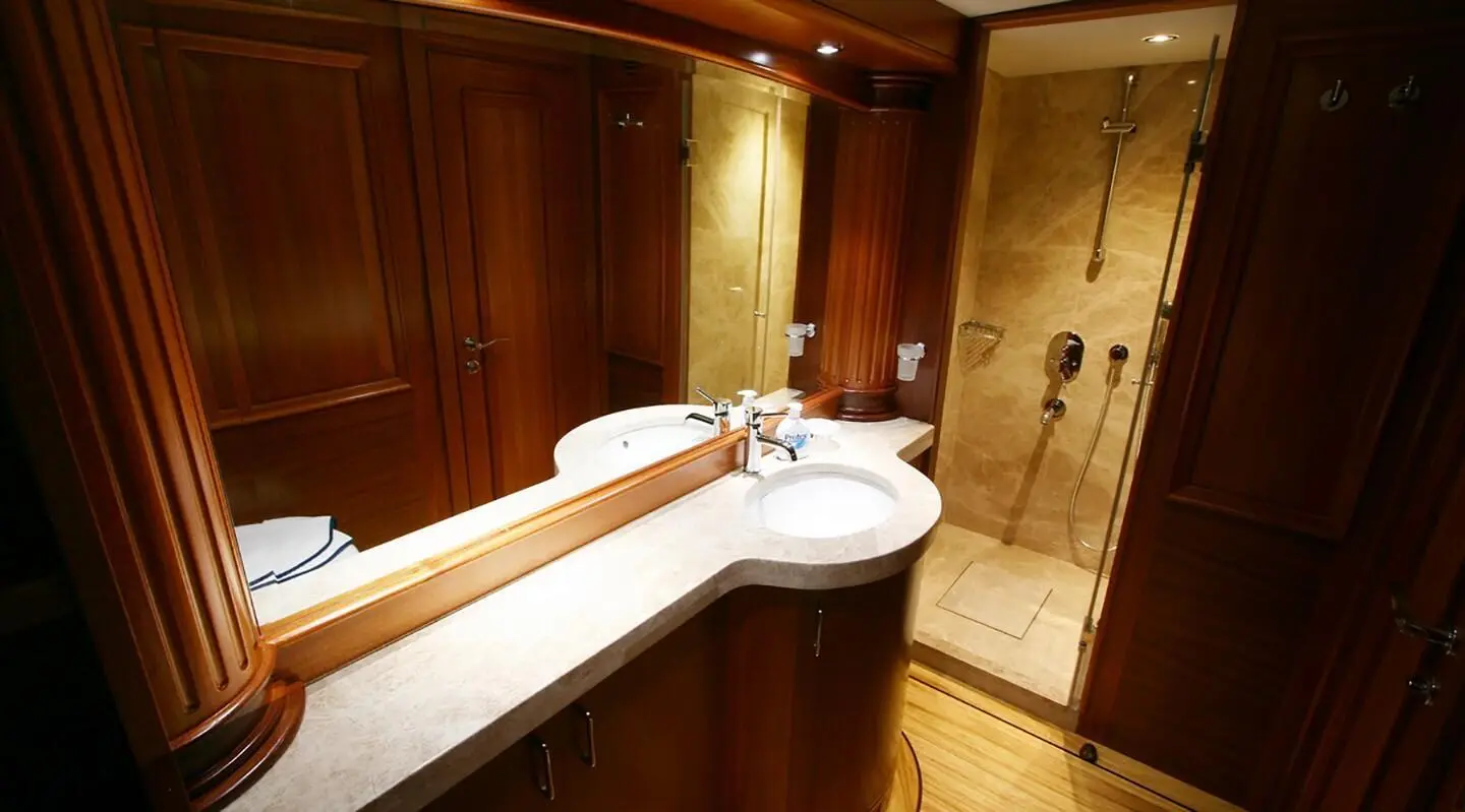 Interior of Kaya Guneri 5 gulet with wooden countertop and bathroom area