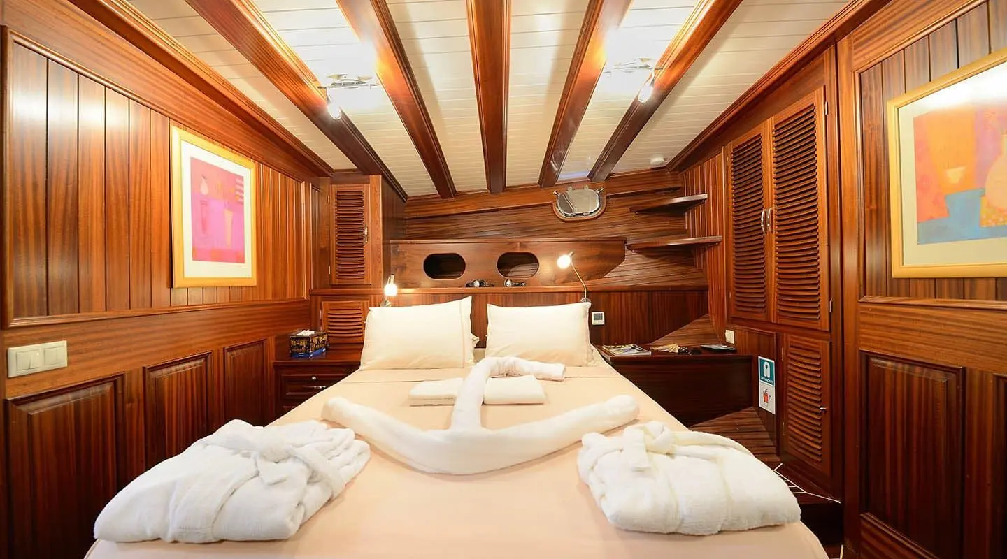 Gulet Zephyria II interior with double cabin, wooden ceiling beams and deck