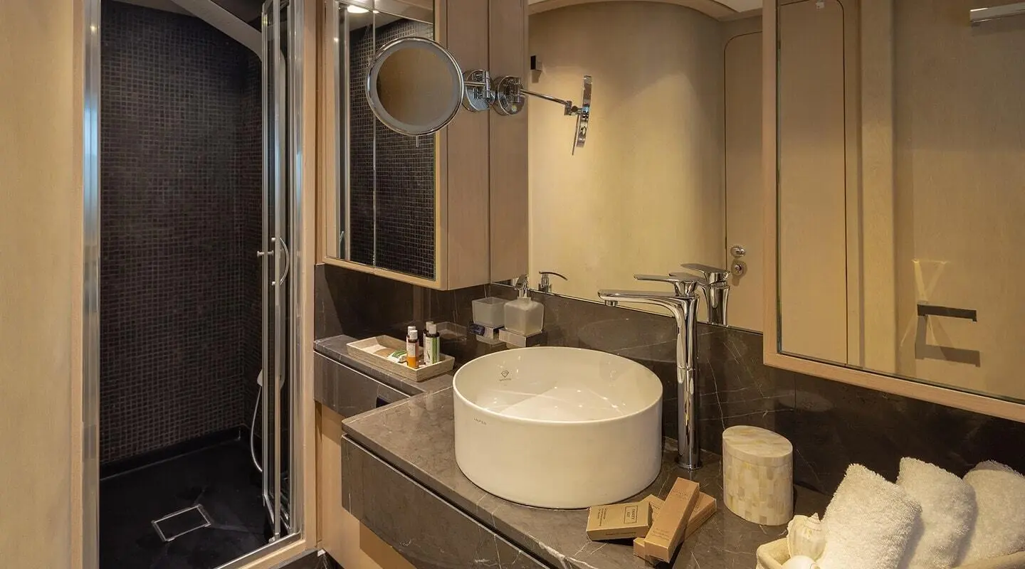 Bathroom on Summer Fun motor yacht with sink, mirror, and counter