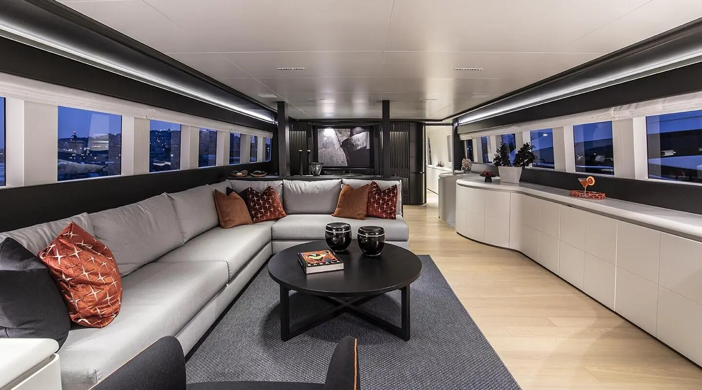 Luxury yacht Project Steel salon interior with seating, coffee table, soft lighting