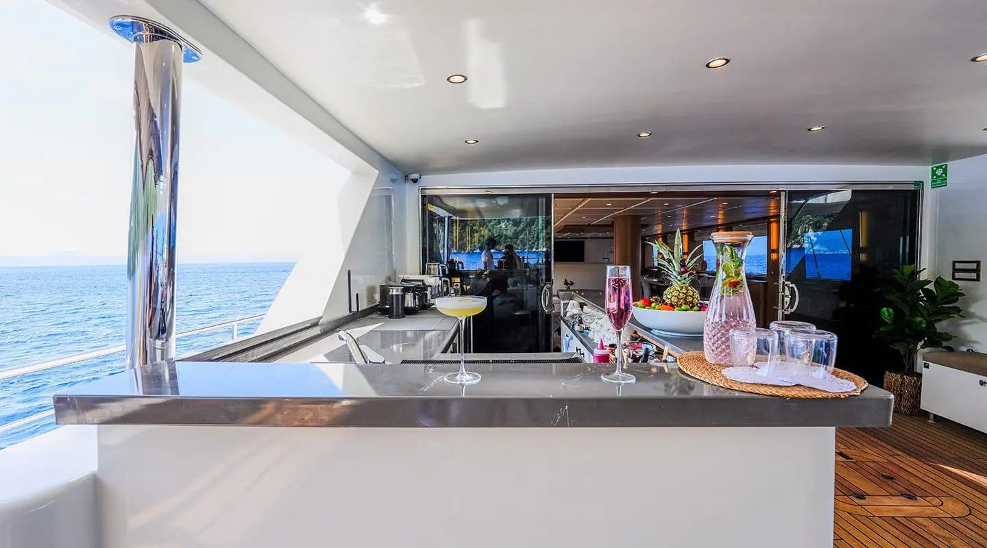 King of the Sea yacht luxury bar deck with seating and ocean view