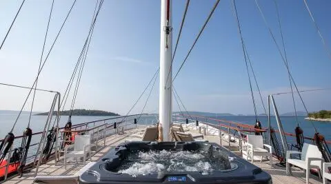 View of Amorena motor yacht with a Jacuzzi on the deck and seating area