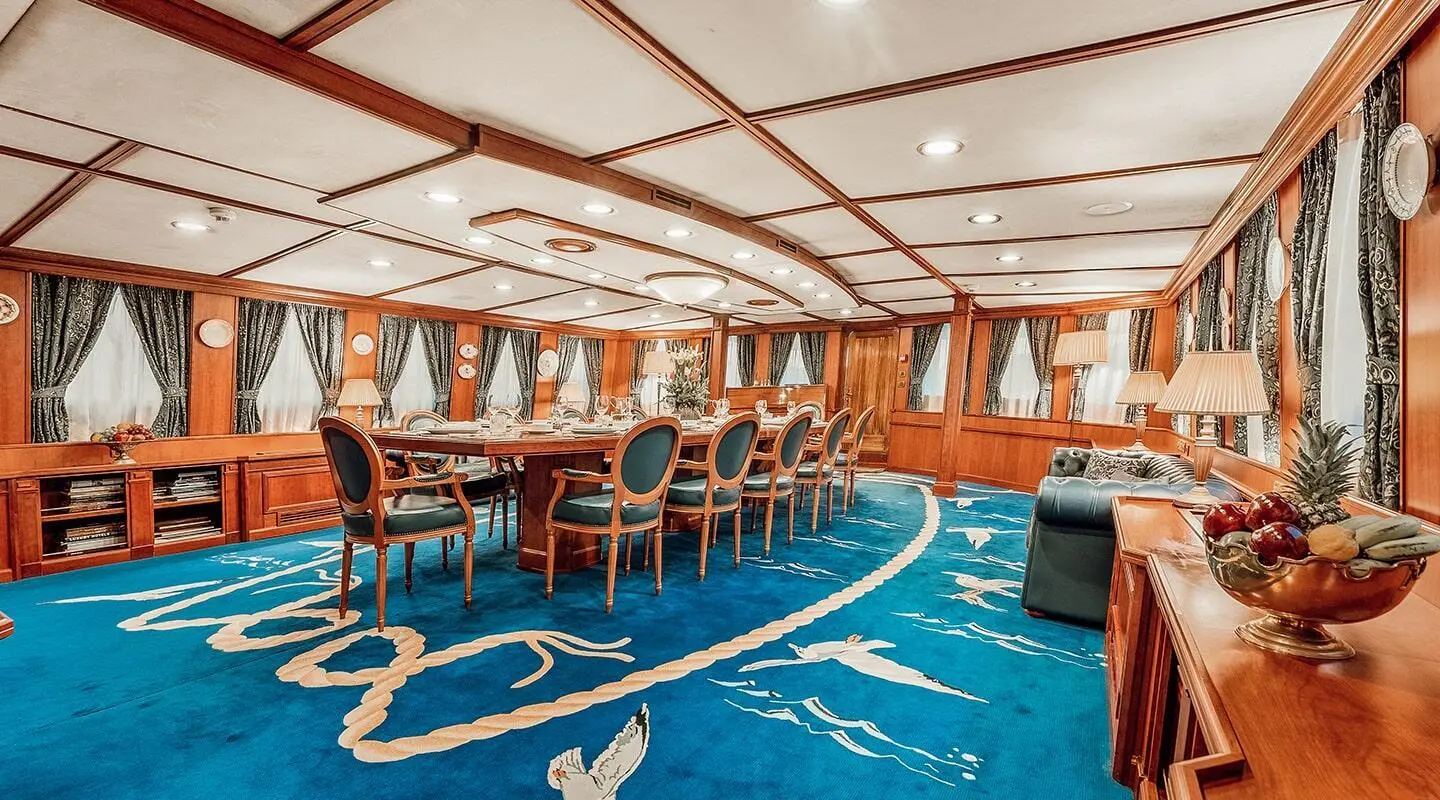 Seagull II yacht dining area with wooden chairs and tables