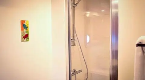 Gulet Virtuoso bathroom with shower and glass enclosure