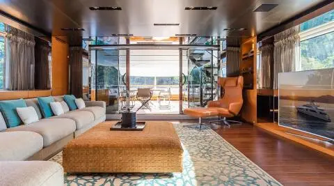 Takara One yacht interior deck lounge with seating area and coffee table during daylight