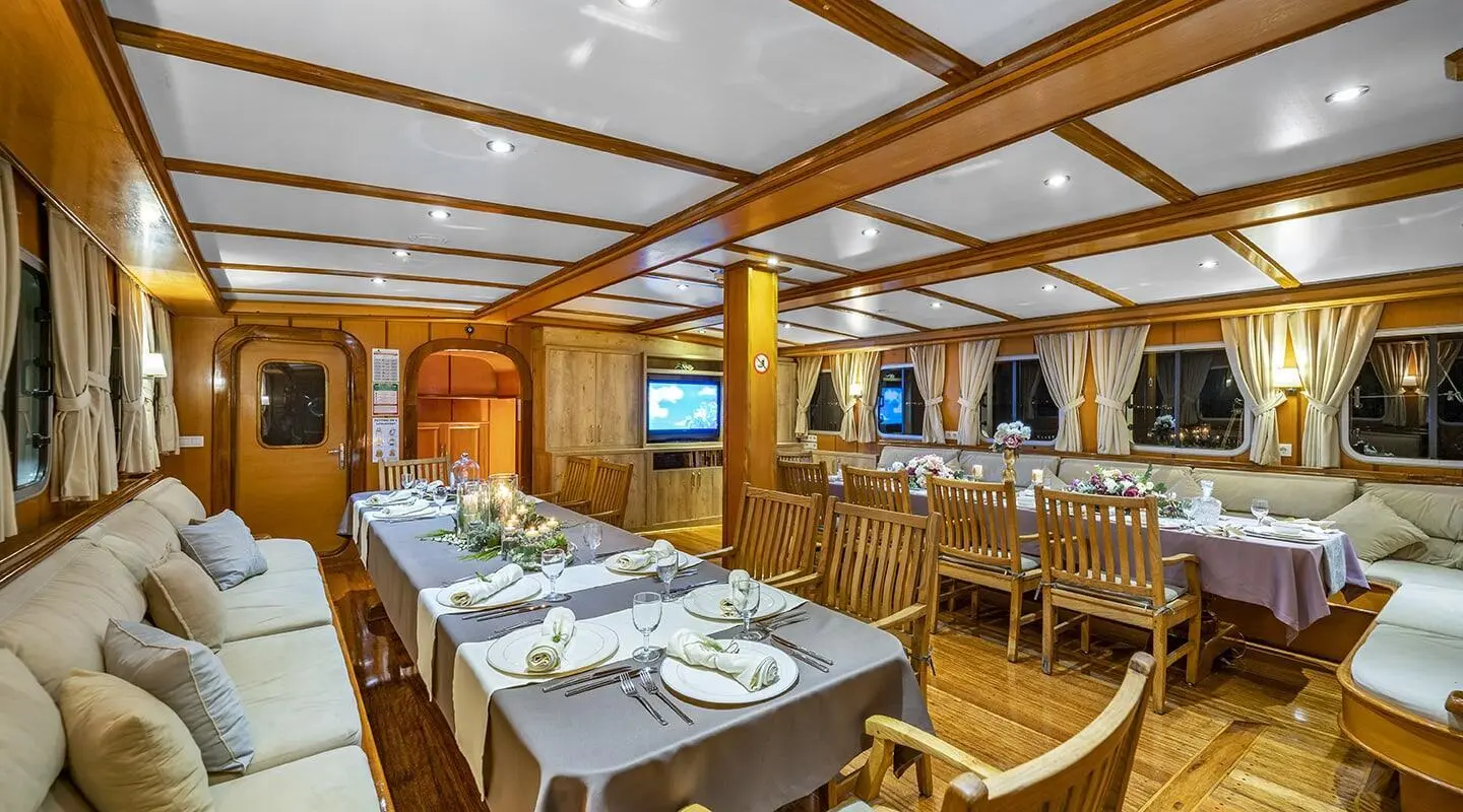 Gulet Tersane 8 saloon interior with wooden furniture and dining tables