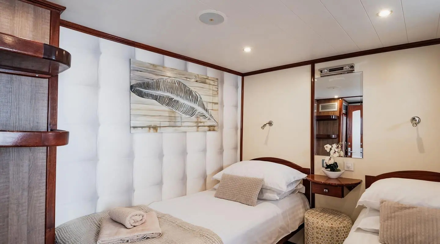 Twin cabin yacht Mendula interior with two single beds and organized wardrobe