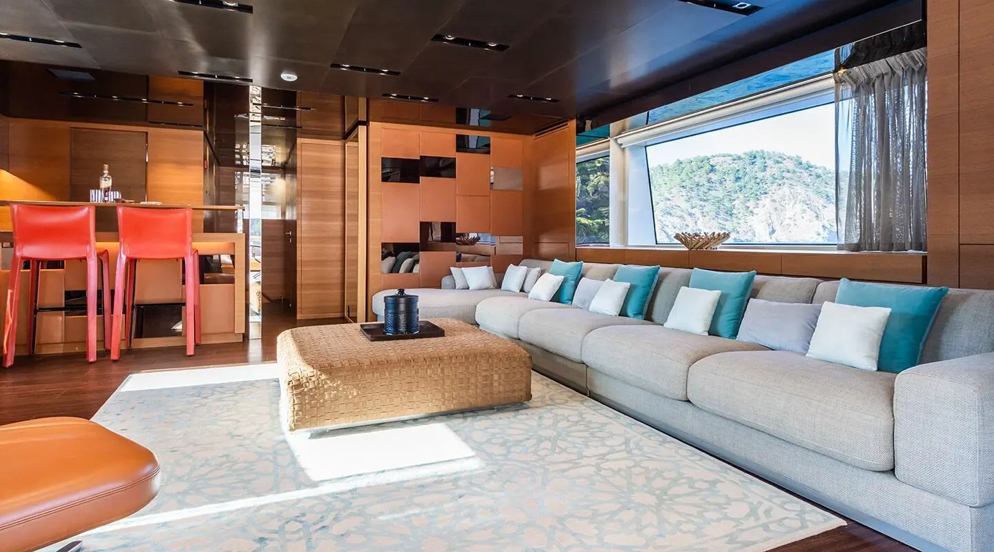 Takara One yacht salon with cream seating, wooden accents, and large windows