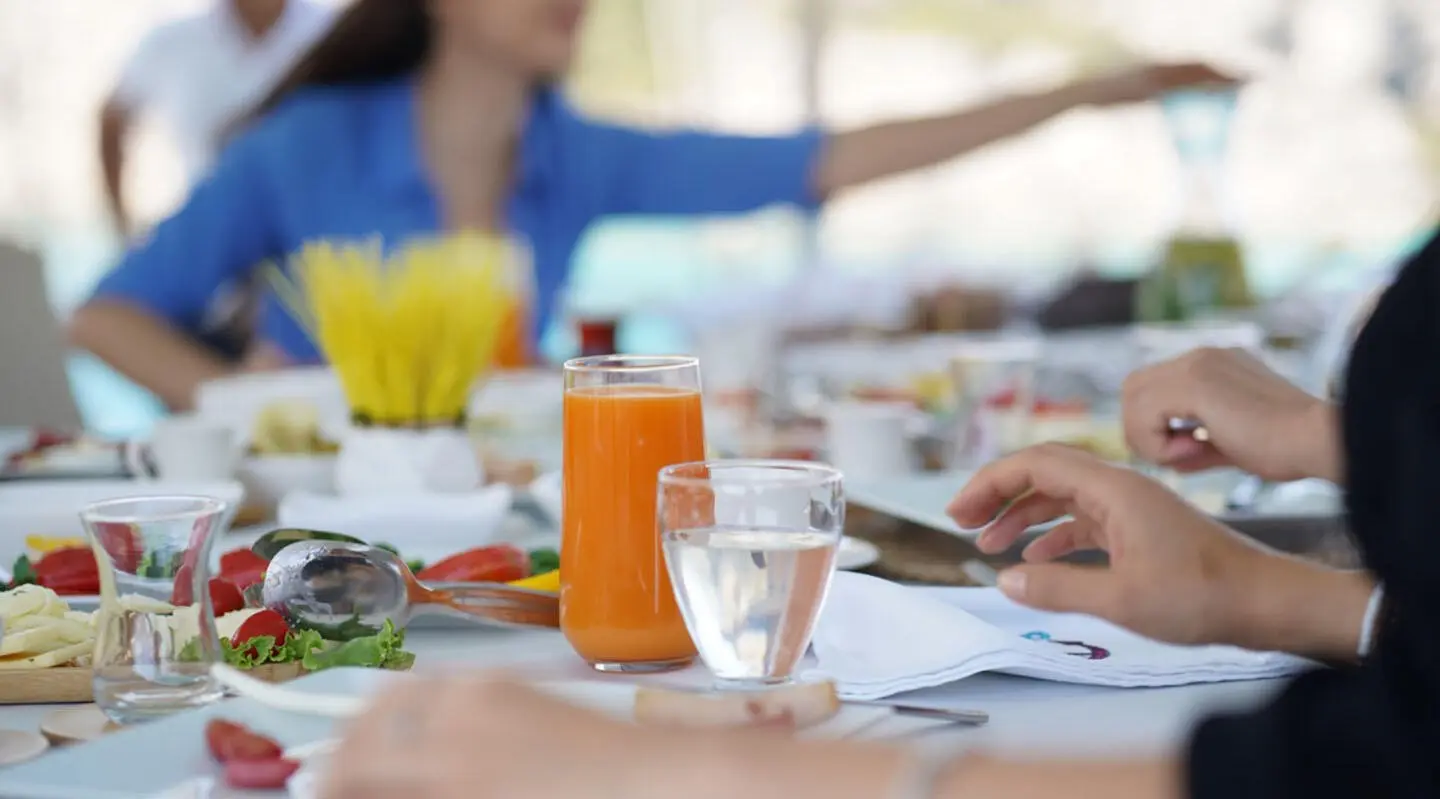 Prenses Esila yacht dining on deck with fresh juice and plated dishes outdoor