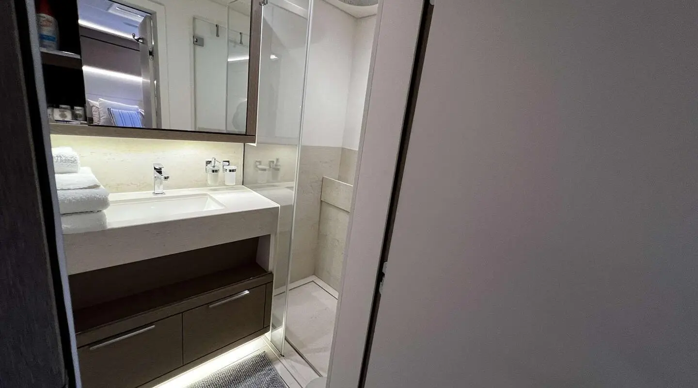 Just Marie 2 luxury yacht bathroom vanity and glass shower on deck