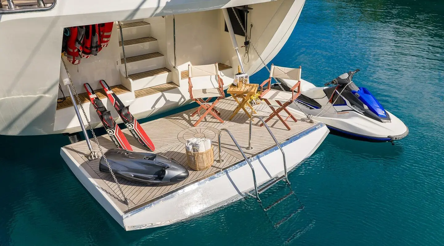 Alessandro I yacht deck at sunset with seating and lifebuoy on stern