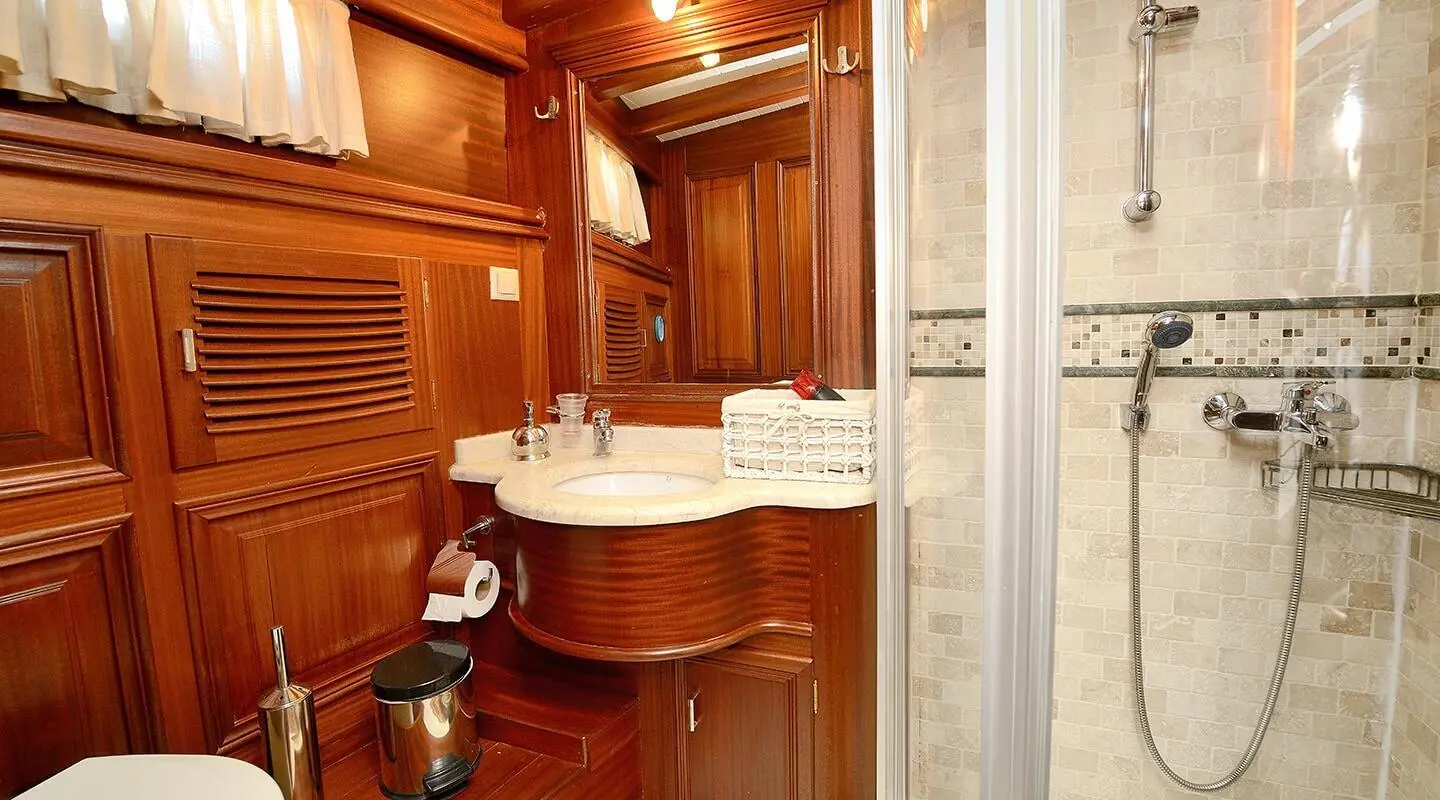 Luxurious yacht Samarkand interior with polished wood, seating, and cabin entry