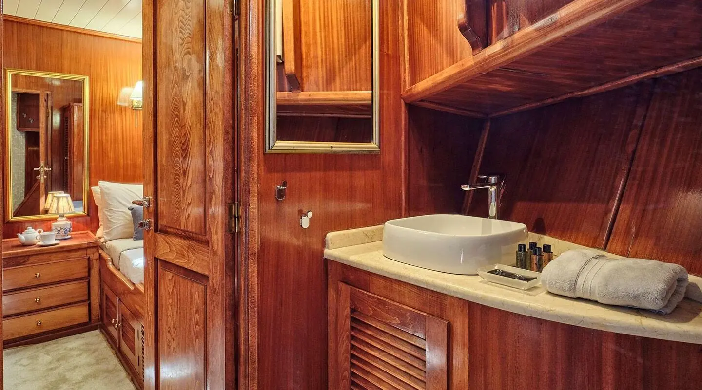 Luxurious yacht Myra bathroom with wooden cabinetry and sink area