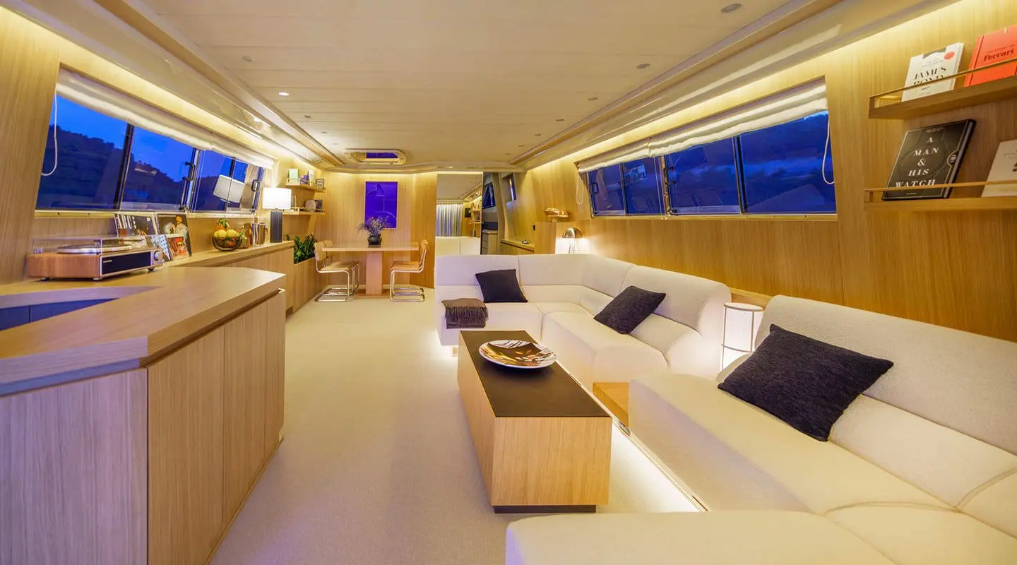 Interior of Phantom yacht saloon with seating areas and warm lighting