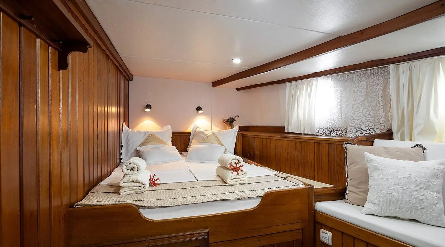 Interior of Aborda luxury gulet with wooden panels and two sunbeds