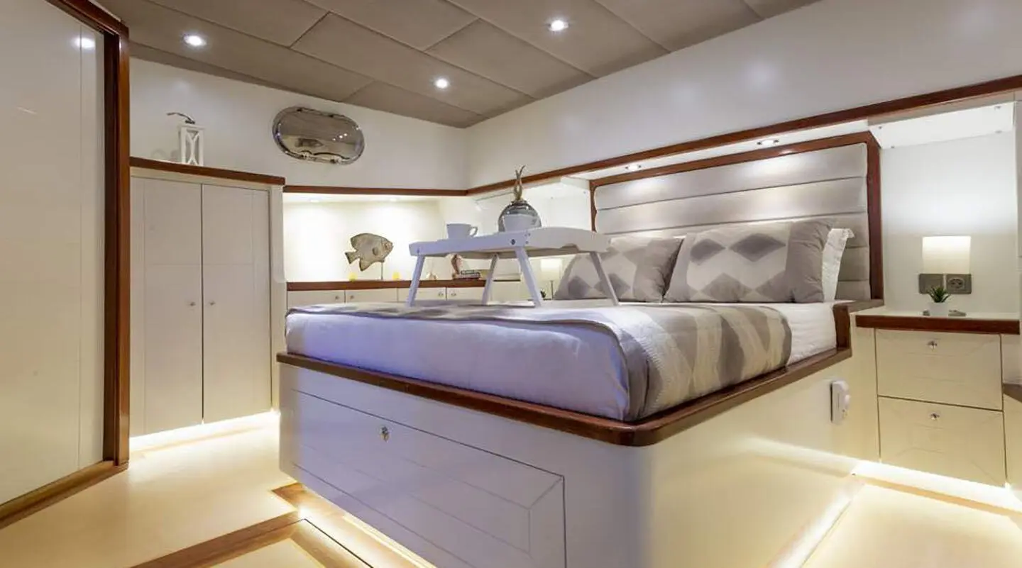 Luxurious Grand Sailor yacht interior with a large bed and soft lighting