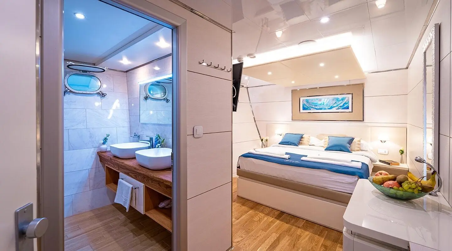 Luxury Riva yacht interior with a bright lounge and blue accented seating