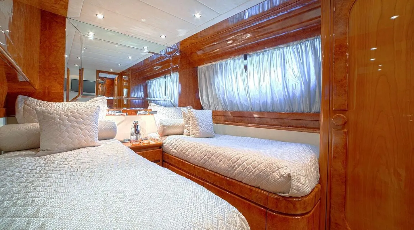 Yacht Zoi interior with polished wood, white furnishings, and large windows