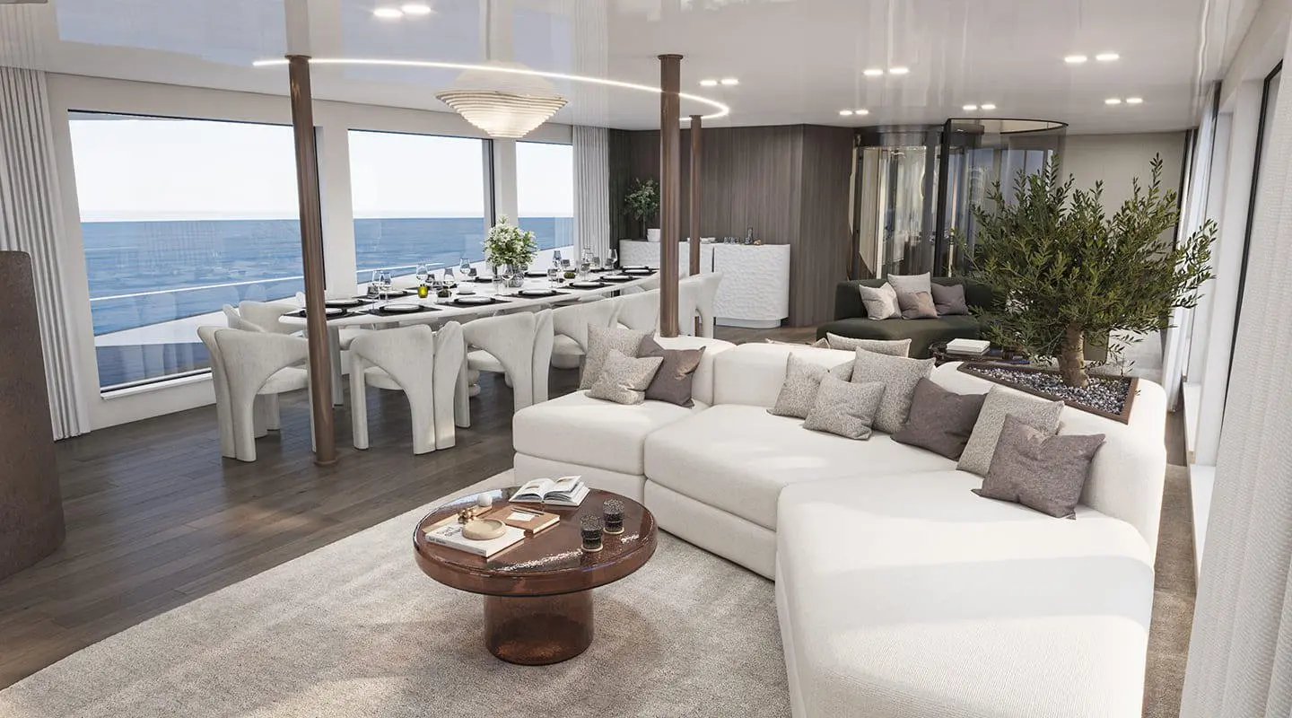 Interior with large white sofa, dining area and ocean view
