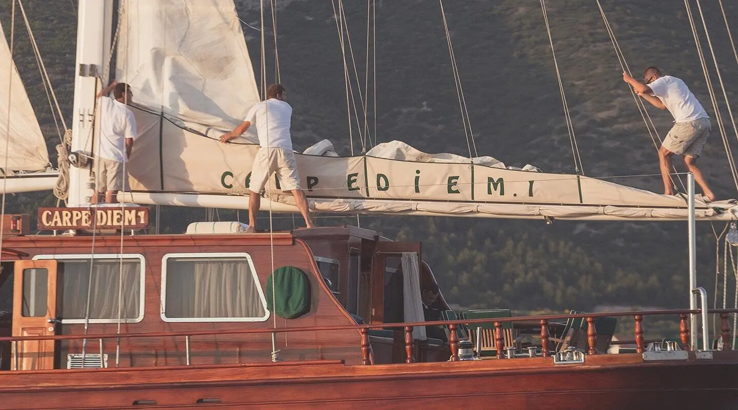 Carpe Diem 7 luxury yacht moored at sunset with red hull and deck details