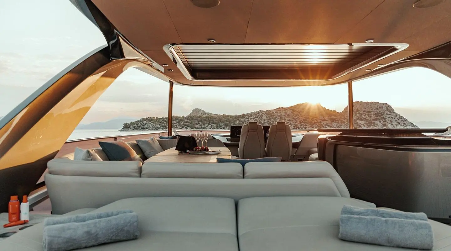 Vista luxury sailing yacht on calm water at sunset, sunlit deck seating