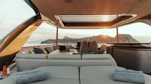 Vista luxury sailing yacht on calm water at sunset, sunlit deck seating