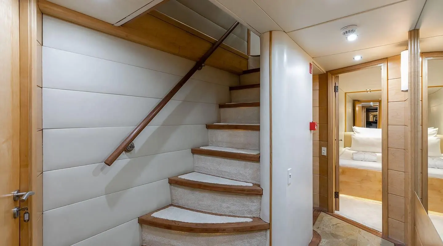 Interior stairs on a luxury yacht Brooklyn, wooden steps and railing