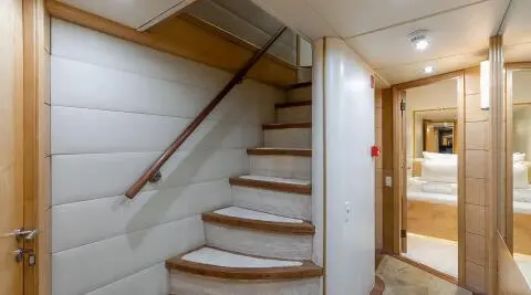 Interior stairs on a luxury yacht Brooklyn, wooden steps and railing