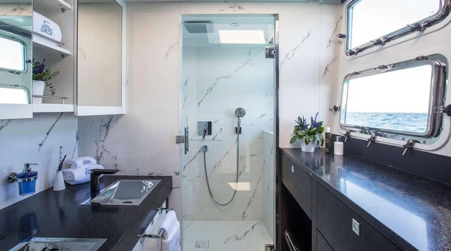 Cartouche luxury gulet yacht interior: modern shower, glass door, sink area