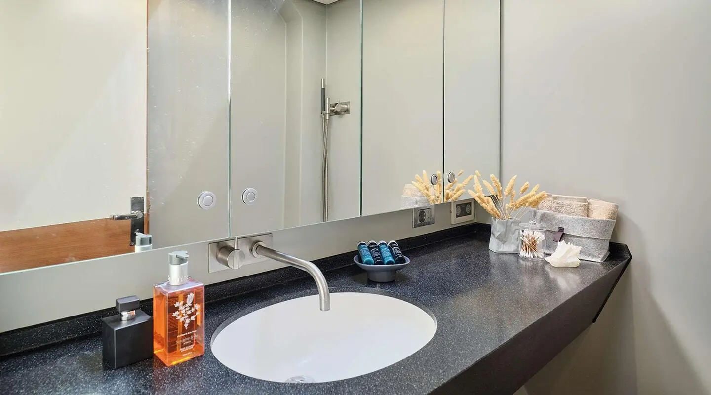 Yacht Aizu bathroom sink area with round white basin and tiled counter